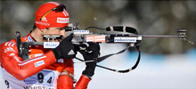 biathlon sportsmen is shooting